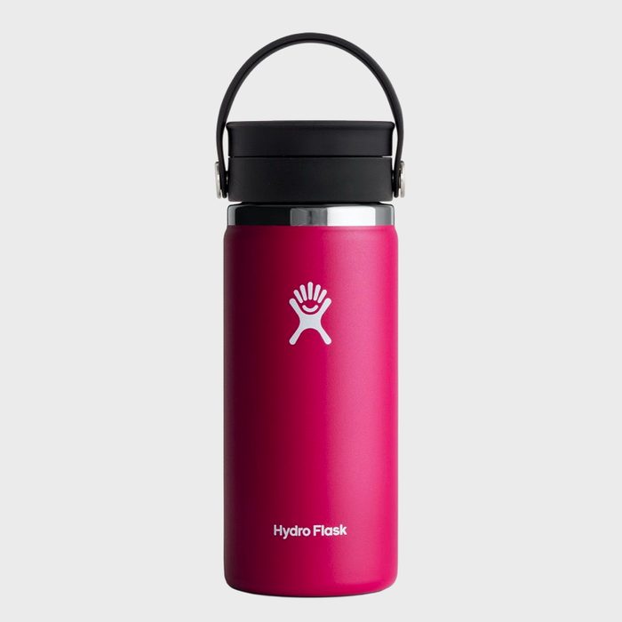 Pink water bottle stands upright, showcasing a black lid and handle, against a plain grey background. 