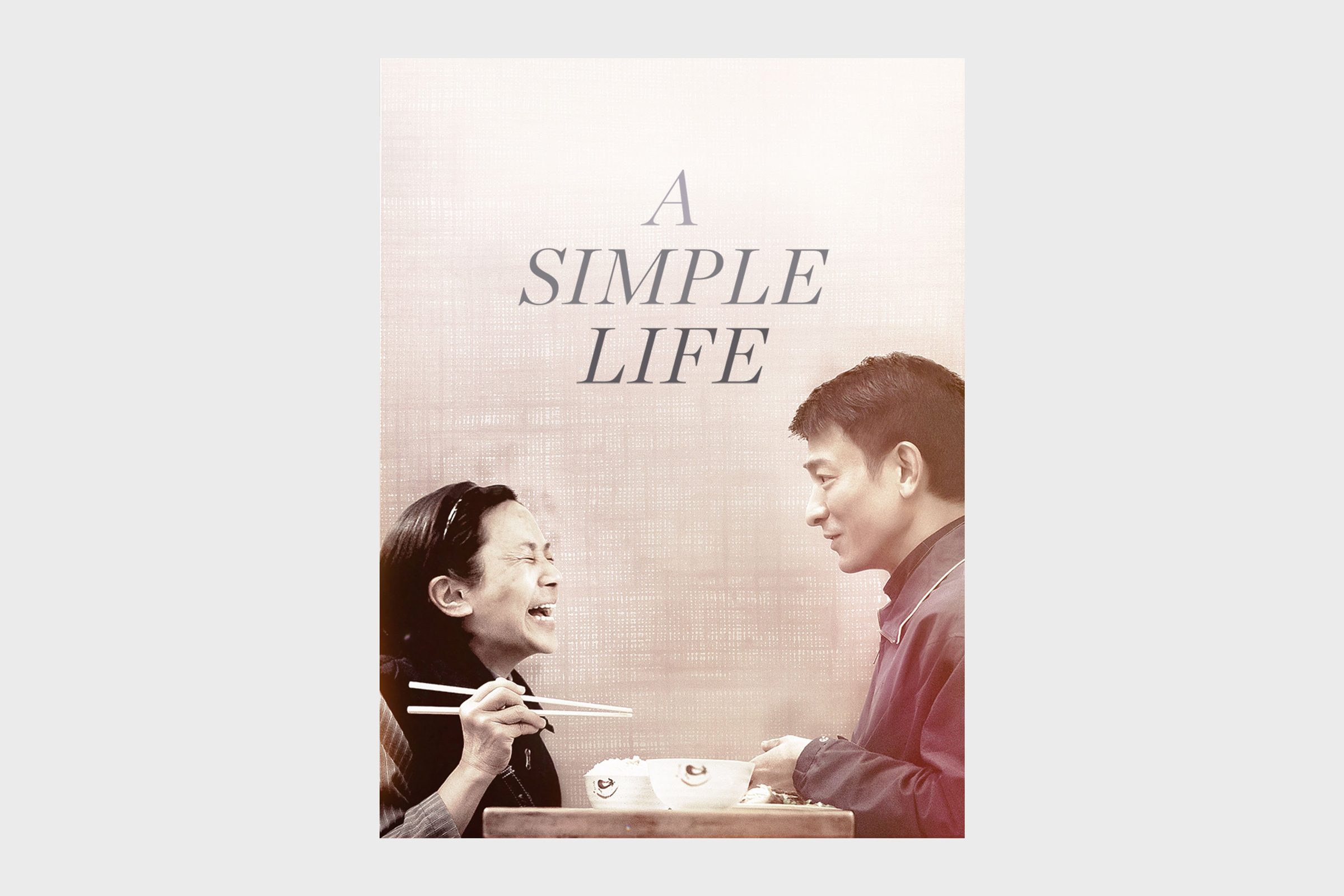 Two people converse while eating; one laughs holding chopsticks before two bowls. The backdrop is a textured beige surface. Text reads: &acirc;&euro;&oelig;A Simple Life.&acirc;&euro;
