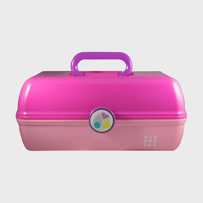 Pink plastic case with handle, lying closed. Adorned with colorful geometric logo. Sets against a plain background.