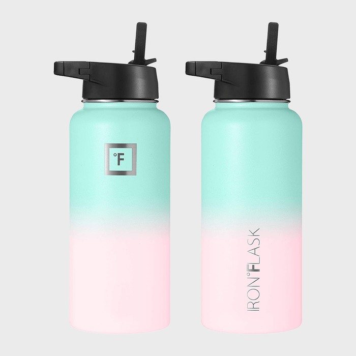 Two gradient green-to-pink water bottles stand upright, each with black lids featuring spouts. Text: 