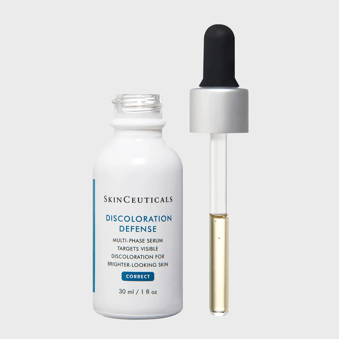 Serum bottle with dropper, positioned upright, against a plain background; labeled 