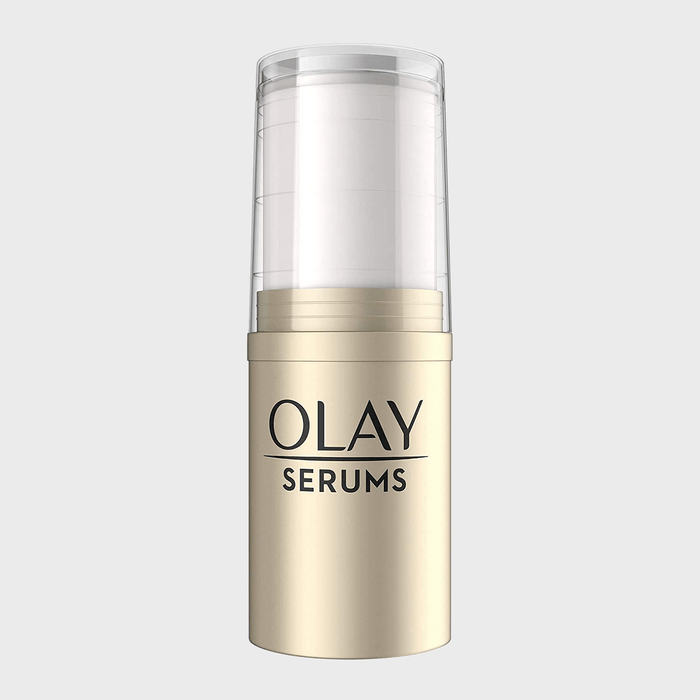 A cylindrical serum bottle stands upright, featuring 