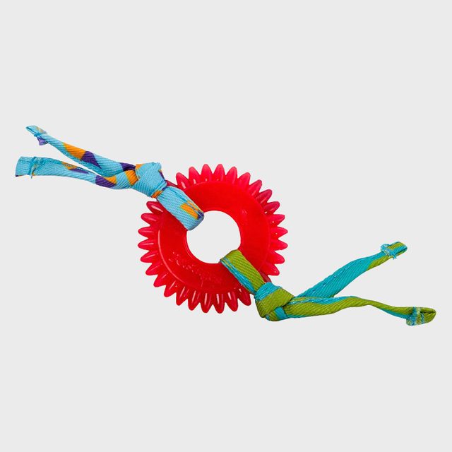 A red spiked ring toy with colorful fabric knots, positioned against a plain white background.