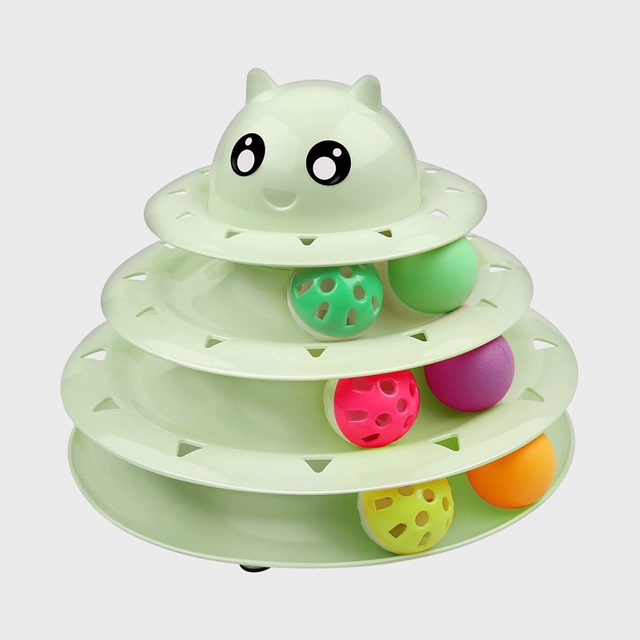 Tiered green cat toy with wide eyes, featuring colorful balls rolling in circular tracks, against a plain white background.