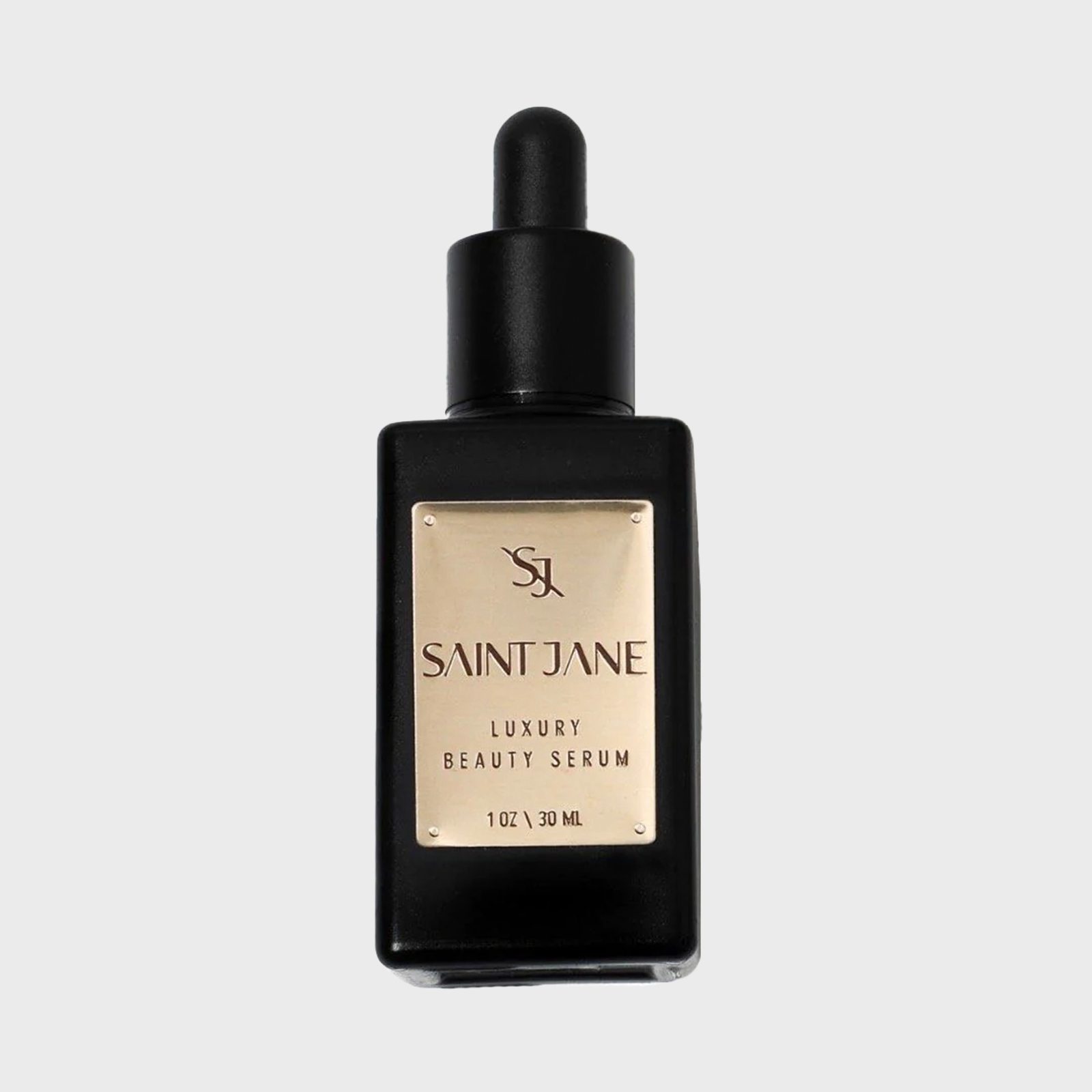 Black dropper bottle displays "Saint Jane Luxury Beauty Serum" on a gold label, set against a plain background.