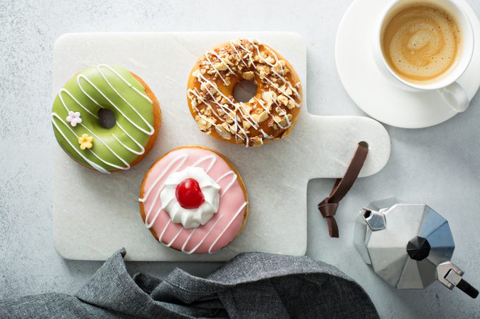 Colorful tasty donuts on a board