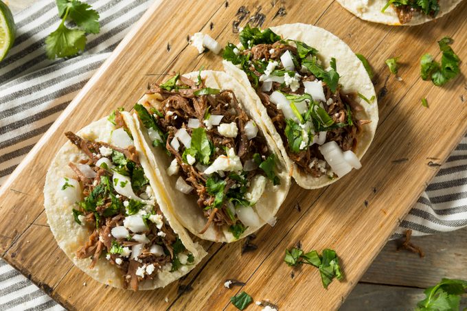 Spicy Homemade Beef Barbacoa Tacos with Cilantro Cheese and Onion
