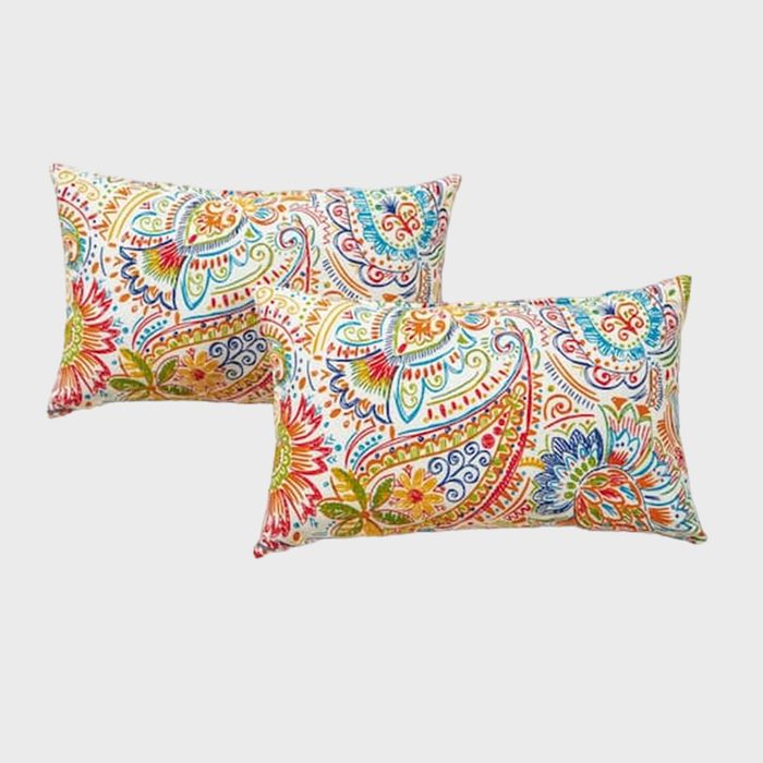 Two vibrant pillows feature colorful paisley and floral patterns, set against a plain white background, highlighting their intricate designs.