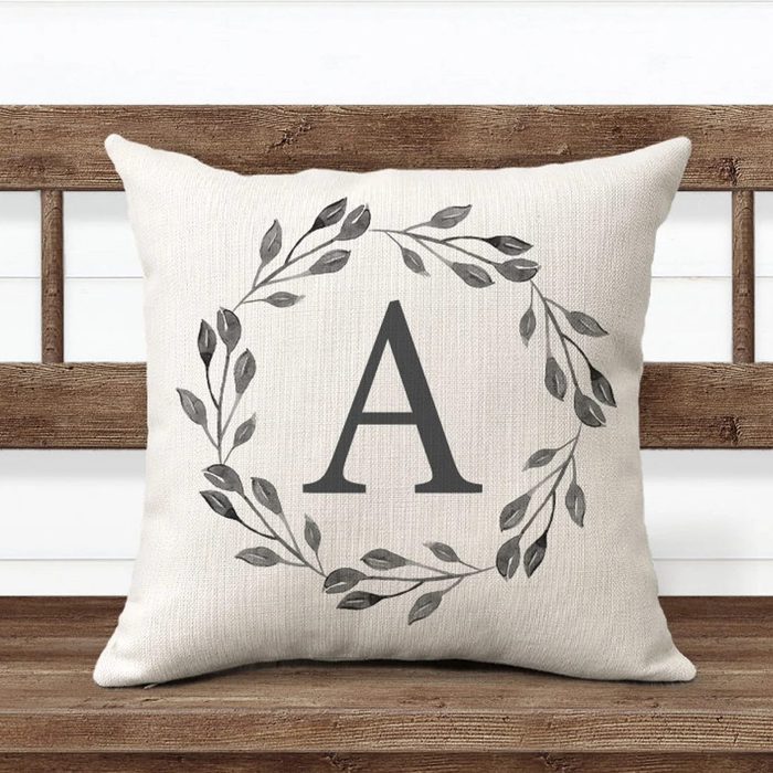 A cushion displays a large letter 