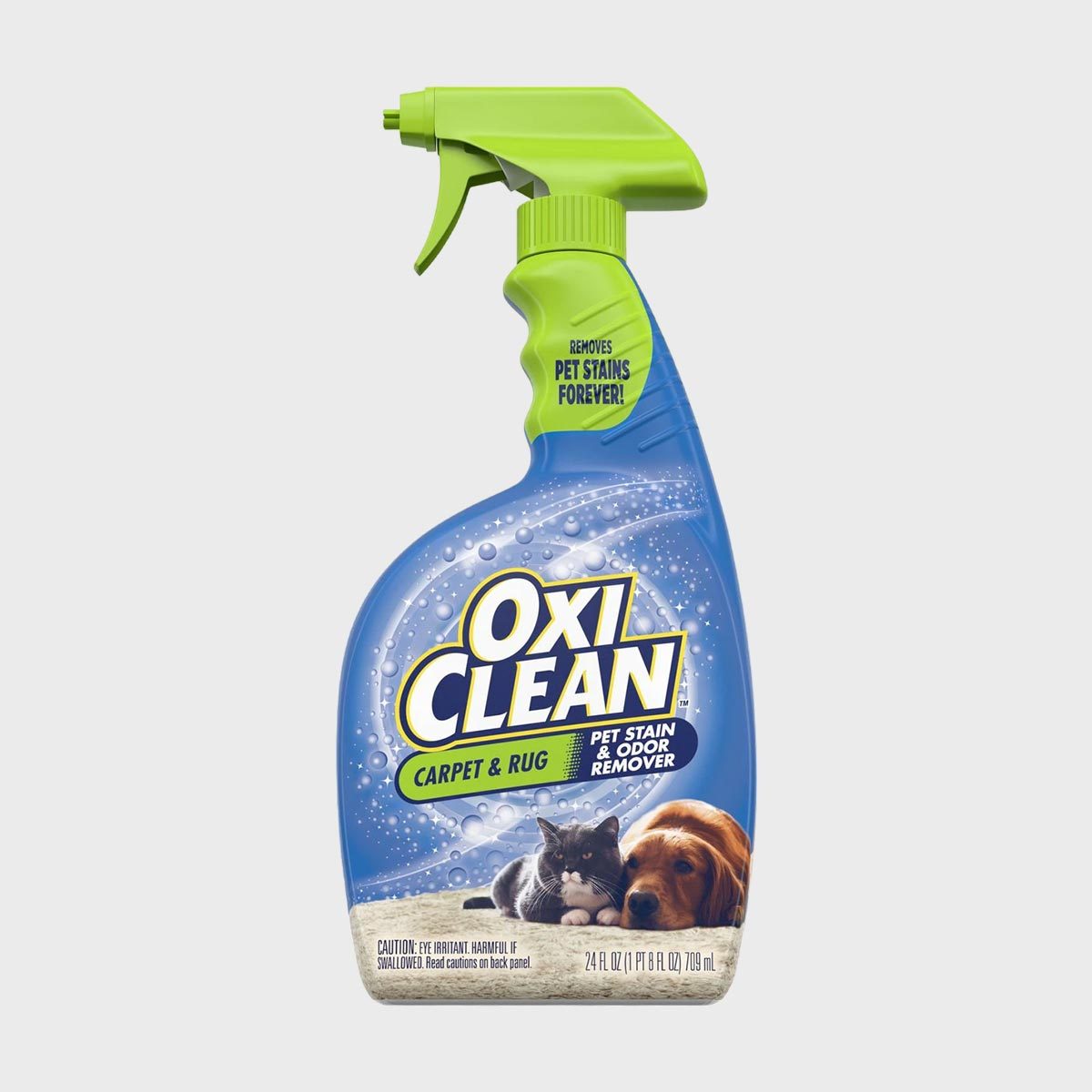 Spray bottle displays "OxiClean Carpet & Rug" for removing pet stains and odors, featuring images of a cat and dog on a white background.