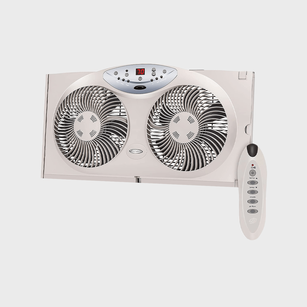 Dual fan with digital display showing 70, operates with an included remote control; set against a plain, light background.