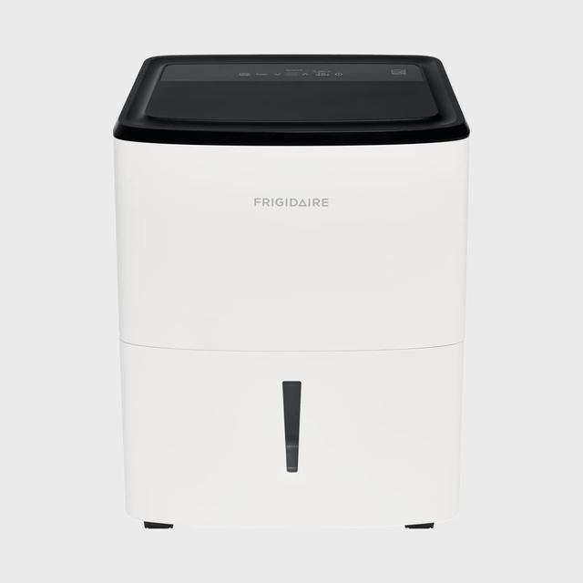 White dehumidifier stands on a flat surface; brand 