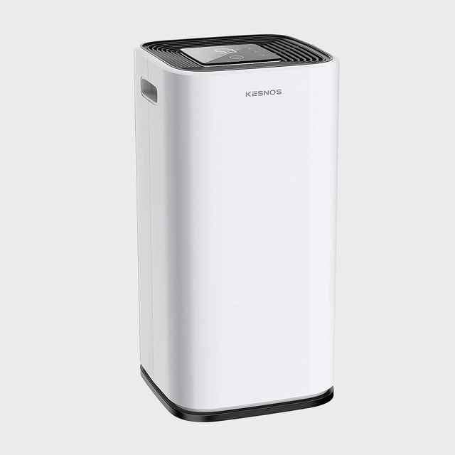 White dehumidifier standing upright; features a digital display on top; labeled 