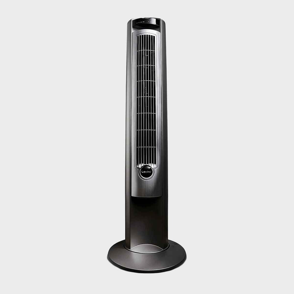 A sleek tower fan stands upright with vents, labeled "Lasko," set against a plain gray background.