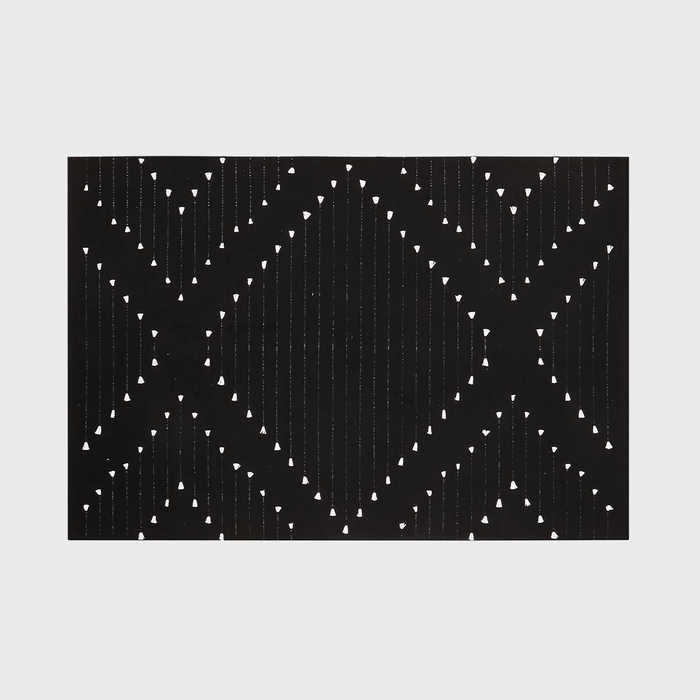 Black rectangle displays a geometric pattern of white triangles and lines, forming intersecting diamond shapes against a plain light gray background.