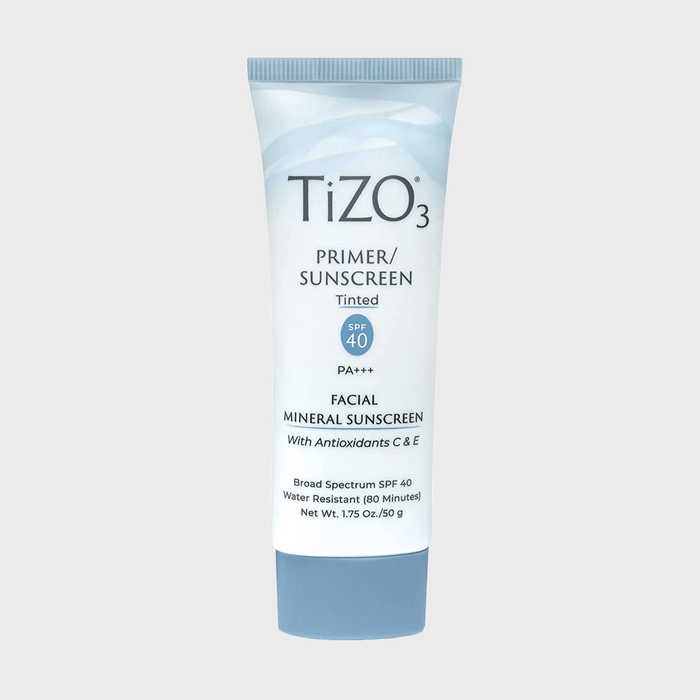 Tube displays text describing a tinted facial mineral sunscreen with SPF 40, antioxidants, and water resistance, set against a plain background.