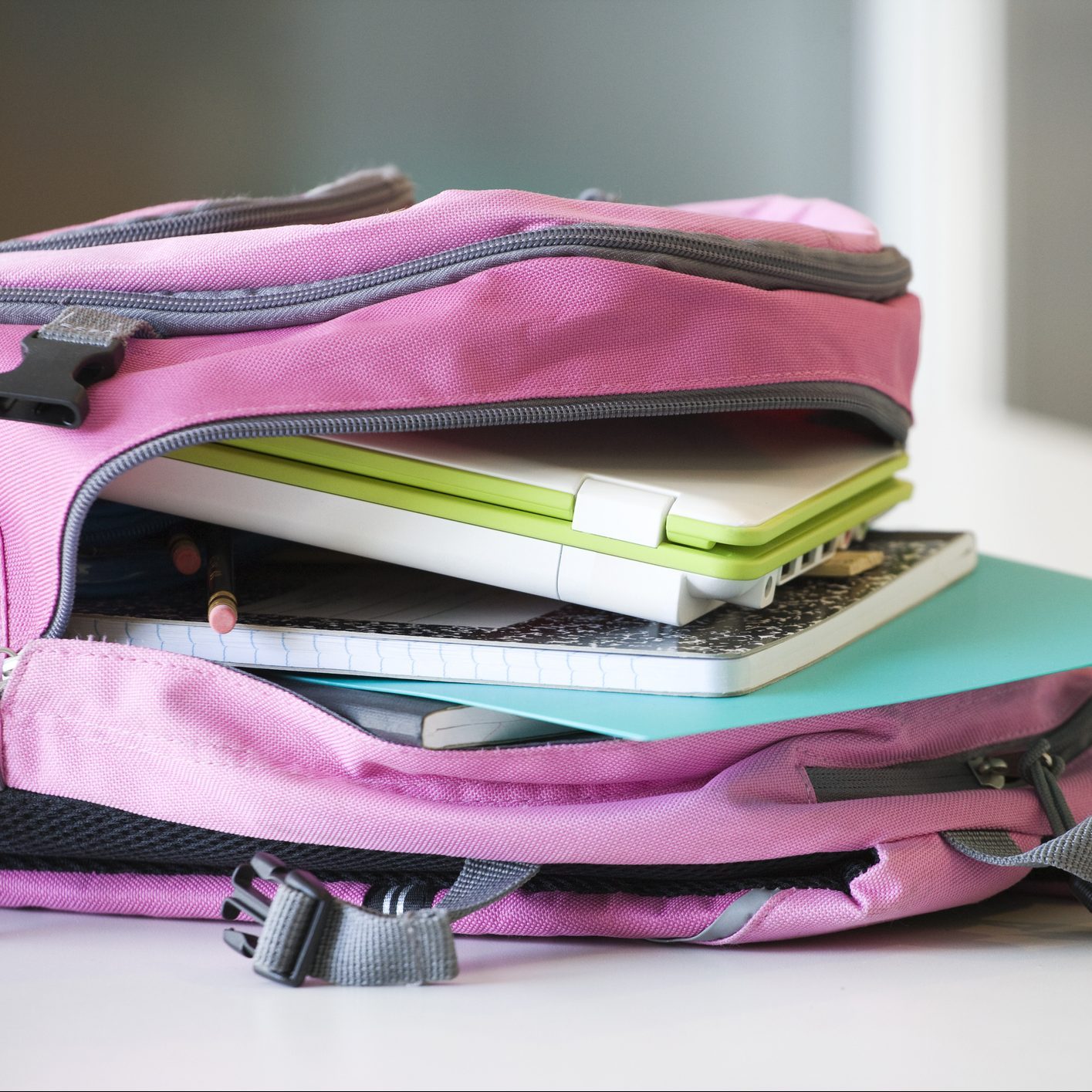 bookbag with laptop and notebooks inside