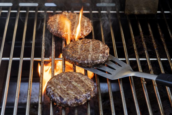 Burgers cooking onbarbecue grill