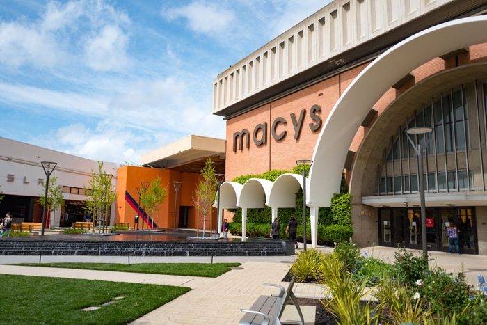 Macy's department store on a sunny day, with a cloudy blue sky, at the Stanford Shopping Center, an upscale outdoor shopping mall in the Silicon Valley town of Stanford, California