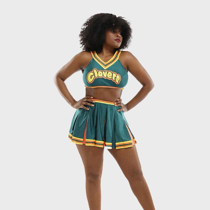 A person stands confidently wearing a green cheerleader outfit with "Clovers" text, set against a plain, light-colored background.