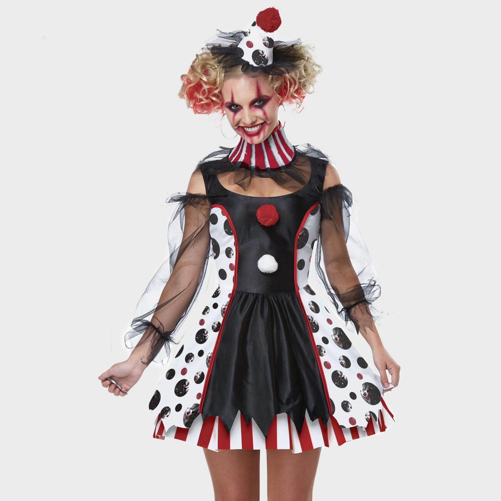 Person wearing a whimsical clown costume, featuring polka dots and ruffles, poses against a plain background, exuding a playful and eerie expression.
