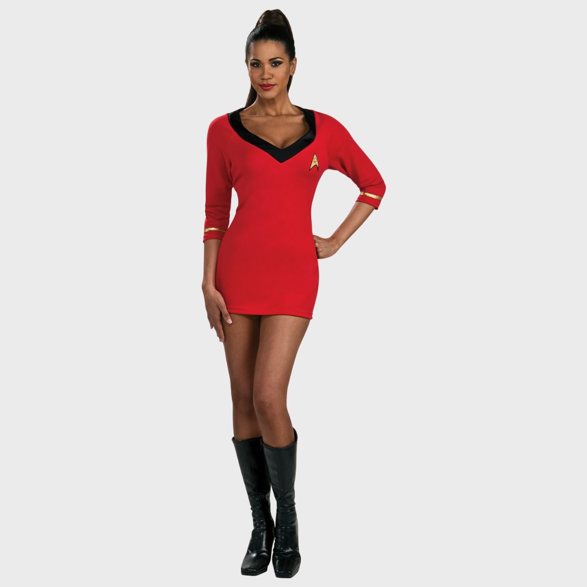 Person wearing a red sci-fi costume with gold details, standing confidently against a plain gray background, hands on hips, black knee-high boots.