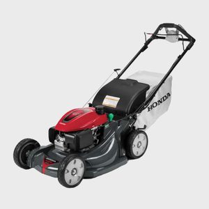 Lawn mower with red and black engine, white bag labeled 