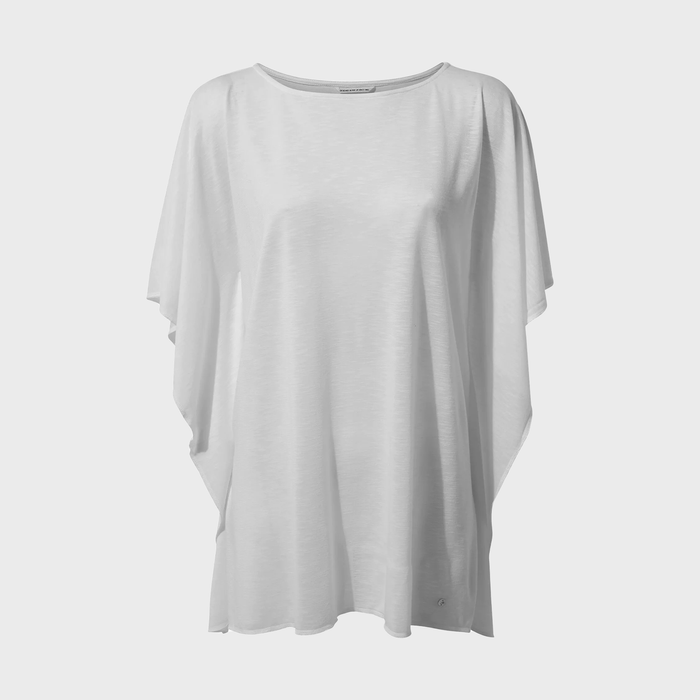 White, loose-fitting blouse hangs against a plain, light background, displaying soft, flowing fabric with short sleeves and a simple round neckline.