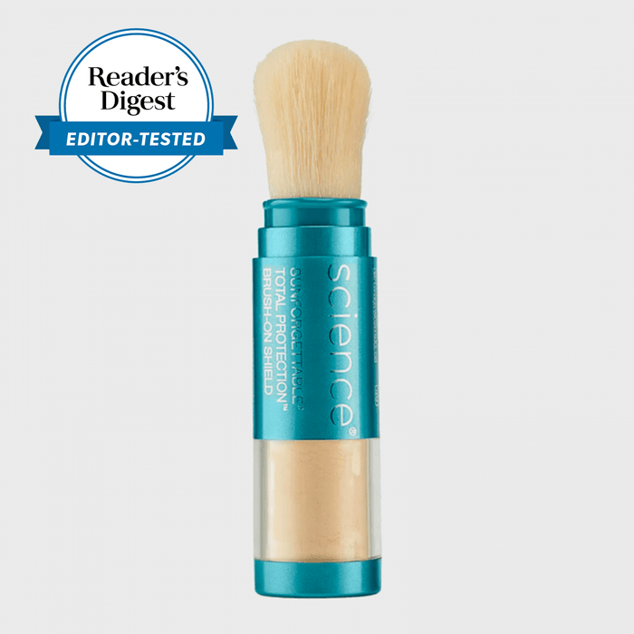 Brush with beige bristles contained in a turquoise tube labeled 