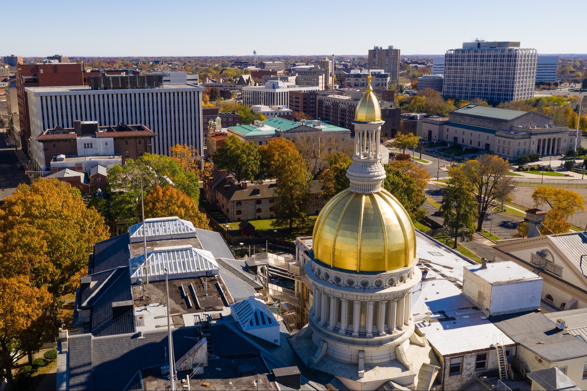 The state capital dome reflects sunlight late afternoon in downtown Trenton New Jersey