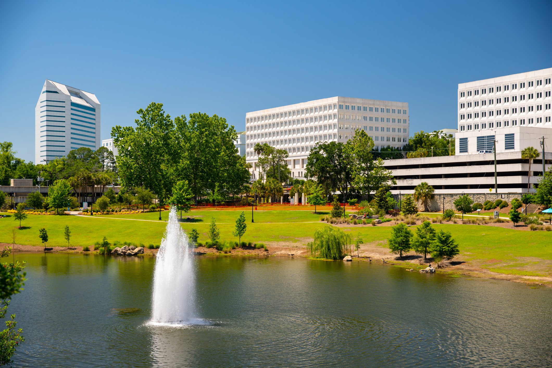 Fountain at Cascades Park Tallahassee FL with buildings in the background