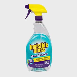 Spray bottle of Invisible Glass cleaner ready for use, featuring a yellow trigger, purple accents, and blue label on a white background.