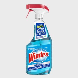 Spray bottle contains blue liquid cleaner, labeled 
