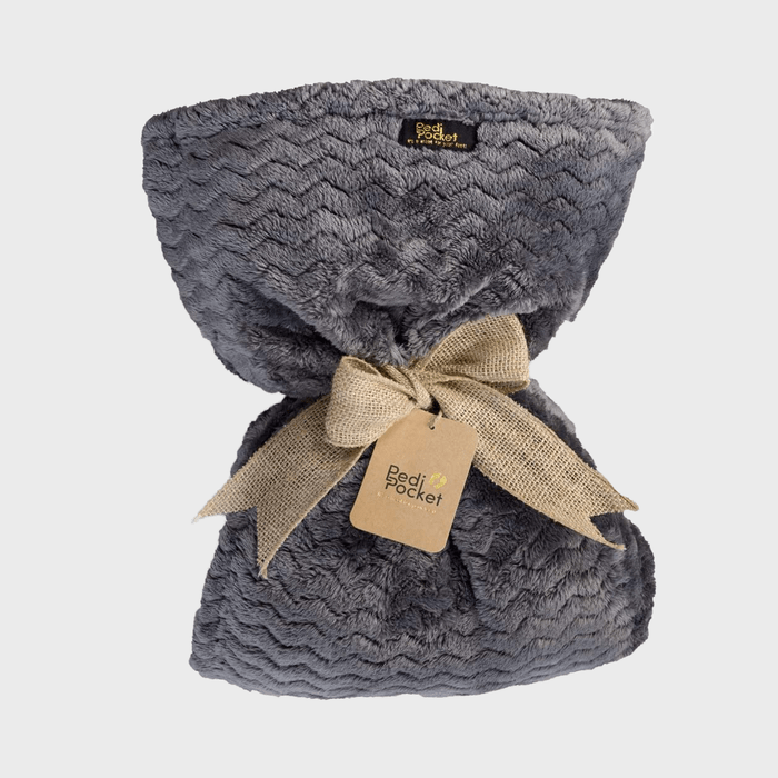 A plush gray blanket, tied with a burlap ribbon, features a 