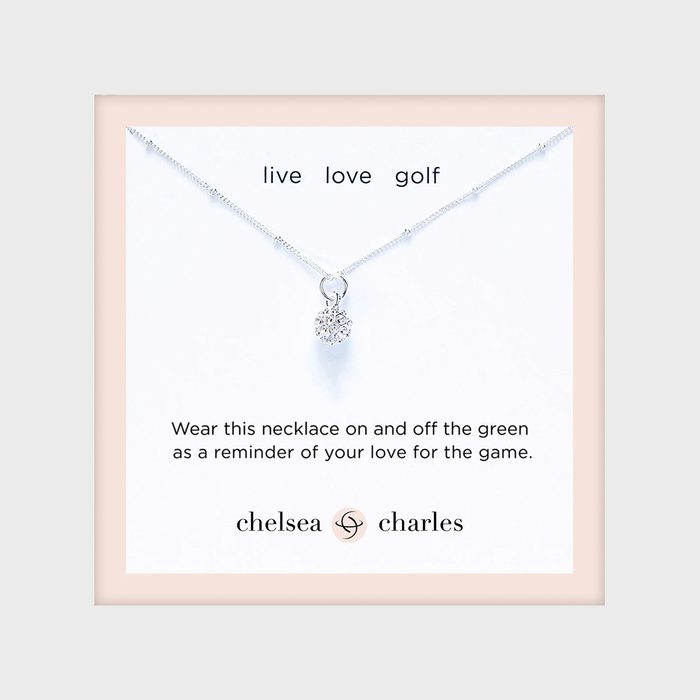 Necklace hangs on display; text reads 