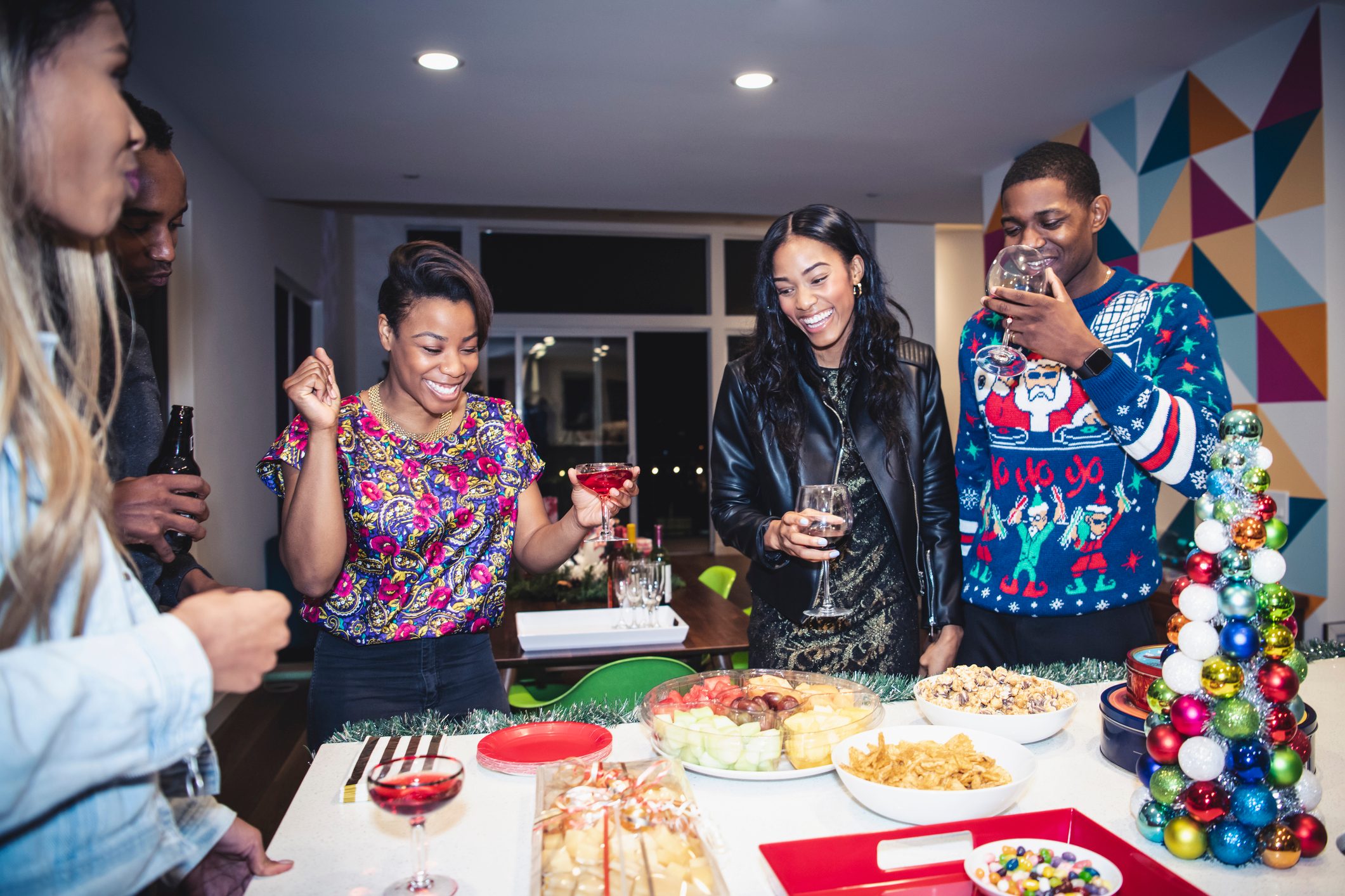 Friends enjoying Christmas party at home