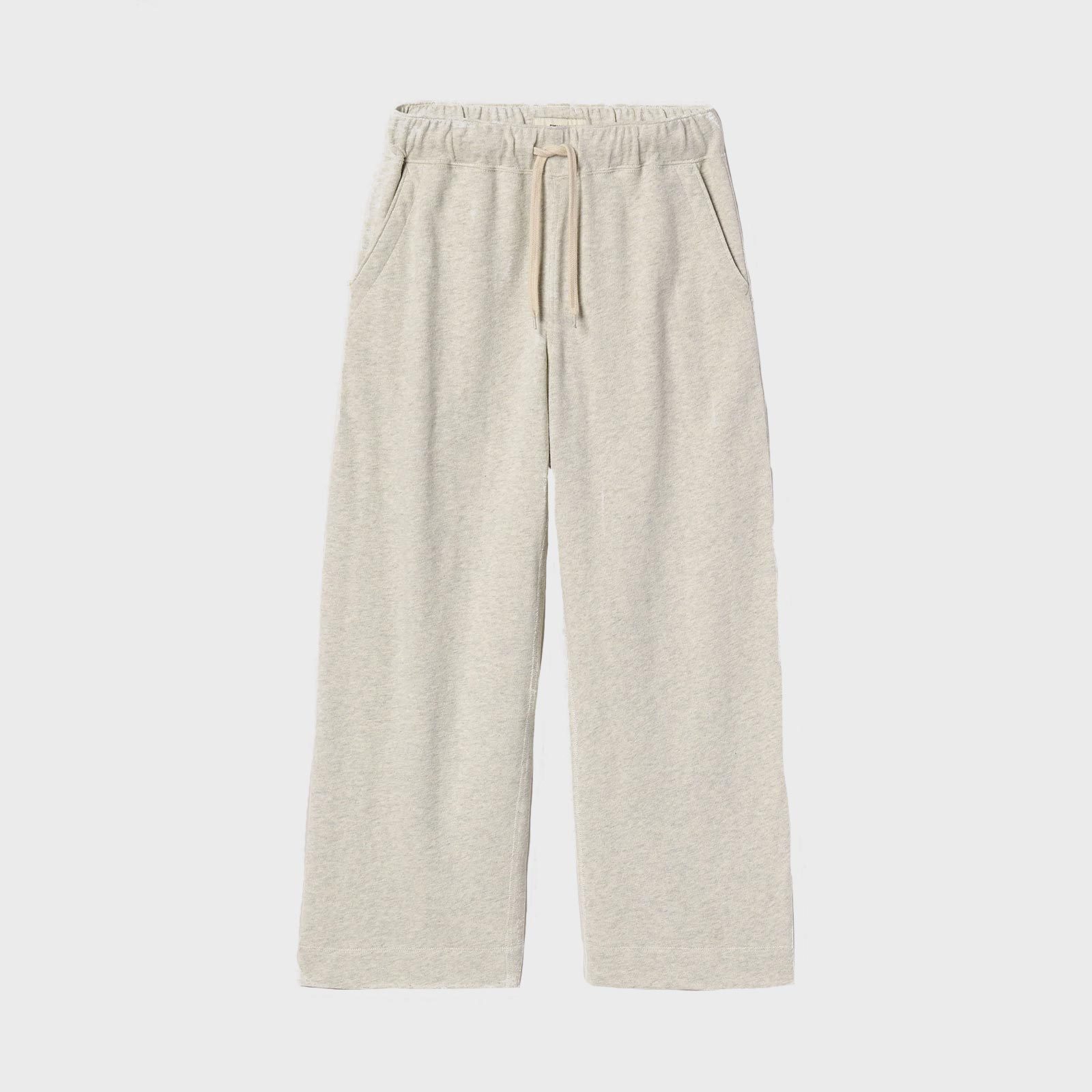 Beige sweatpants are laid flat, showcasing elastic waistband and drawstring, set against a plain white background.