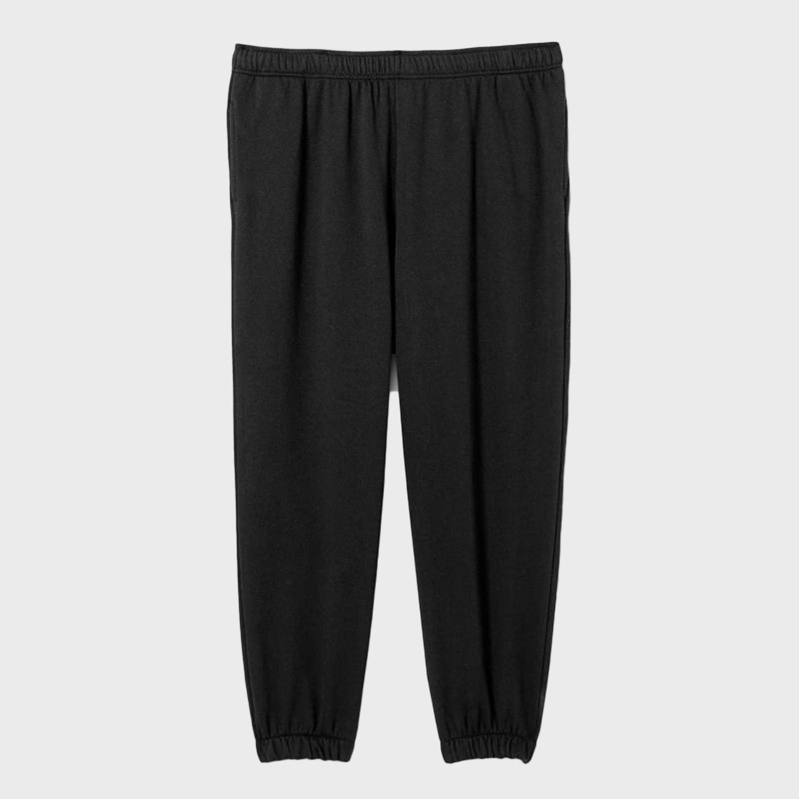 Black jogger pants hang flat, featuring an elastic waistband and cuffs, against a plain gray background.