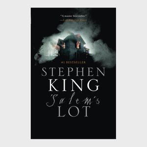 Burning house emits smoke against dark sky; Stephen King's 