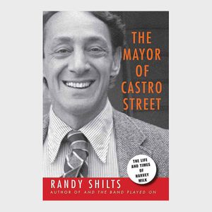 A smiling person is on a book cover; text reads: 