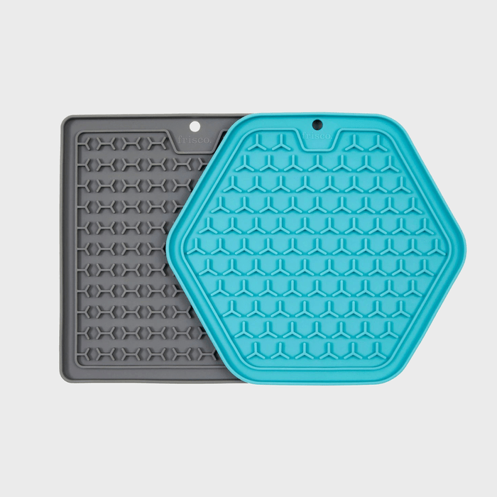 Two silicone licking mats overlap, blue hexagon and gray rectangle, featuring textured patterns. Text 