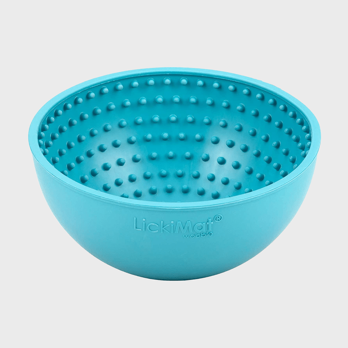 Turquoise rubber bowl with raised dots covers interior; labeled 