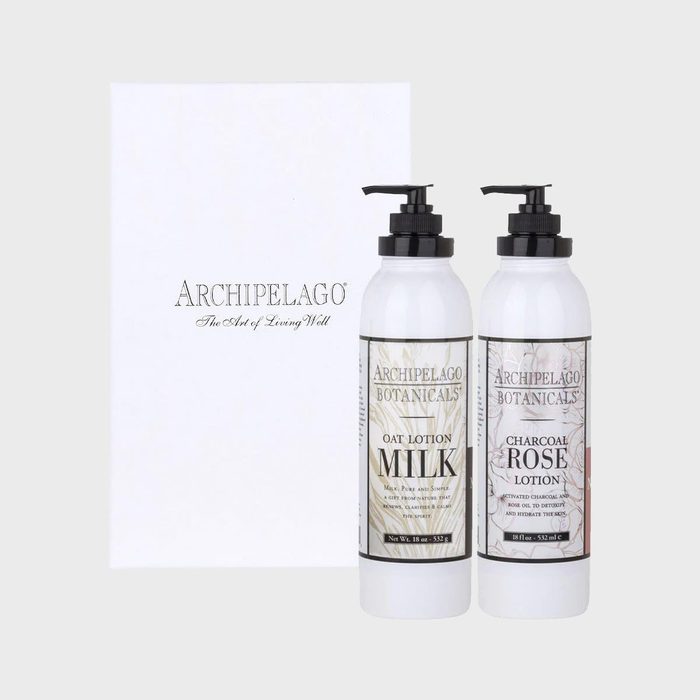 Two lotion bottles with pump tops stand upright; labeled 