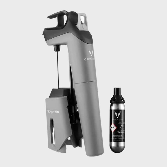 Device with needle extracts wine, accompanied by a gas canister; sleek design, labeled 