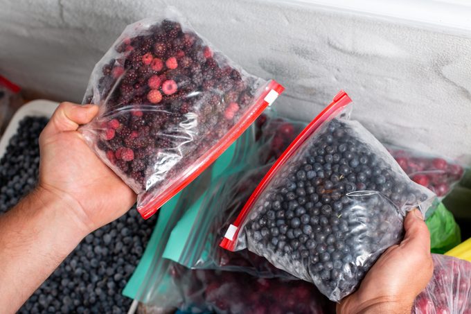 Frozen berries in the freezer. Frozen mixed fruits and berries