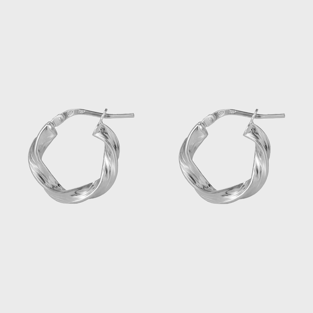 Two twisted silver hoop earrings positioned side by side against a plain white background.
