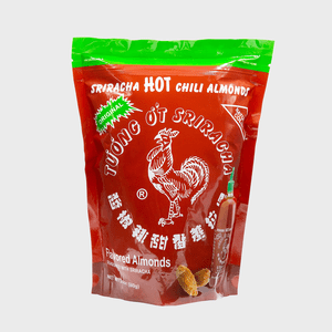 Bag displays Sriracha Hot Chili Almonds with rooster logo, red and green color scheme, featuring several almonds at the bottom.