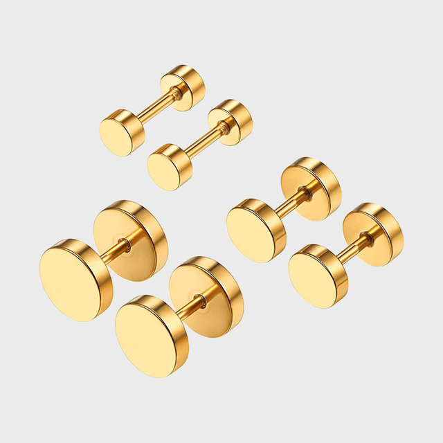 Gold cufflinks displayed in a set, arranged on a plain, light background.