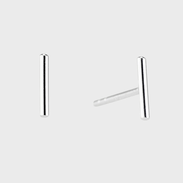 Silver bar stud earrings resting upright, isolated against a plain white background.