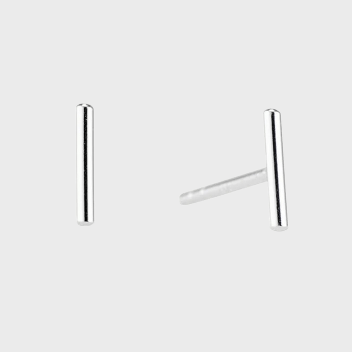 Silver bar stud earrings resting upright, isolated against a plain white background.